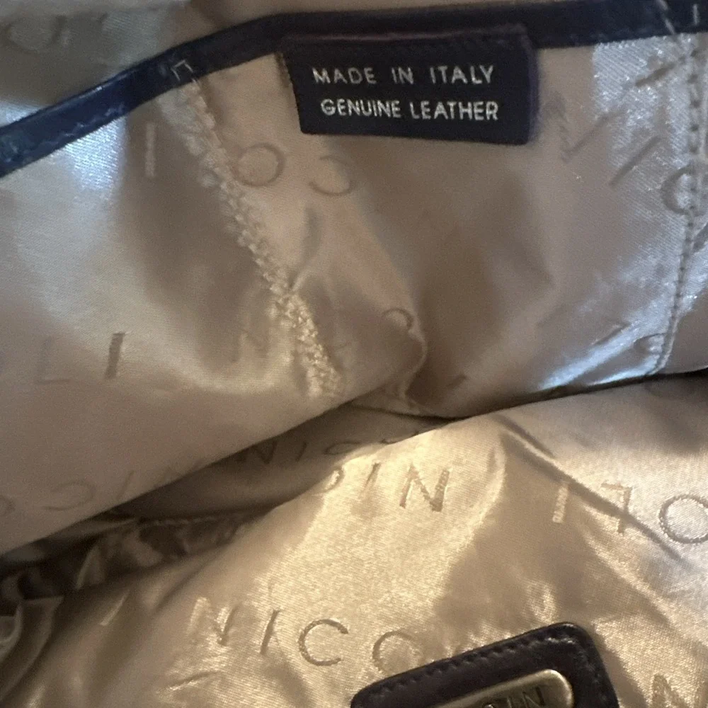 Nicoli Italian leather Large satchel features a dark purplish Blue finish